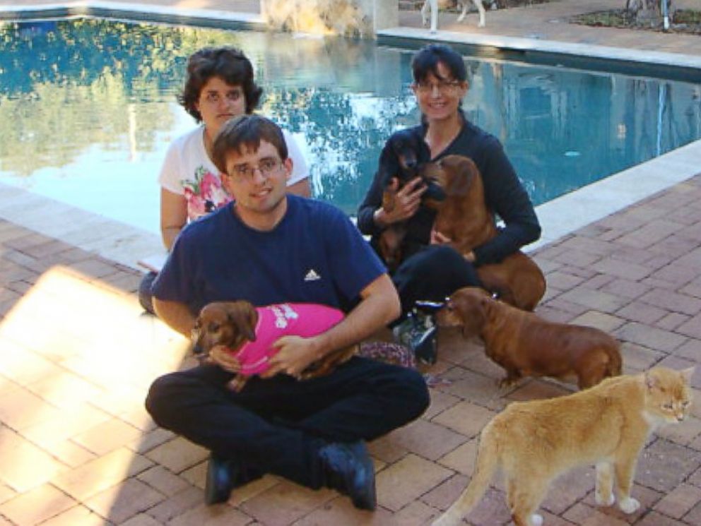 PHOTO: Sandy Lewers, right, on Sunday adopted a disabled dachshund that has comforted her autistic children, Kevin, 21, and Lia, 18, in Tampa, Fla.