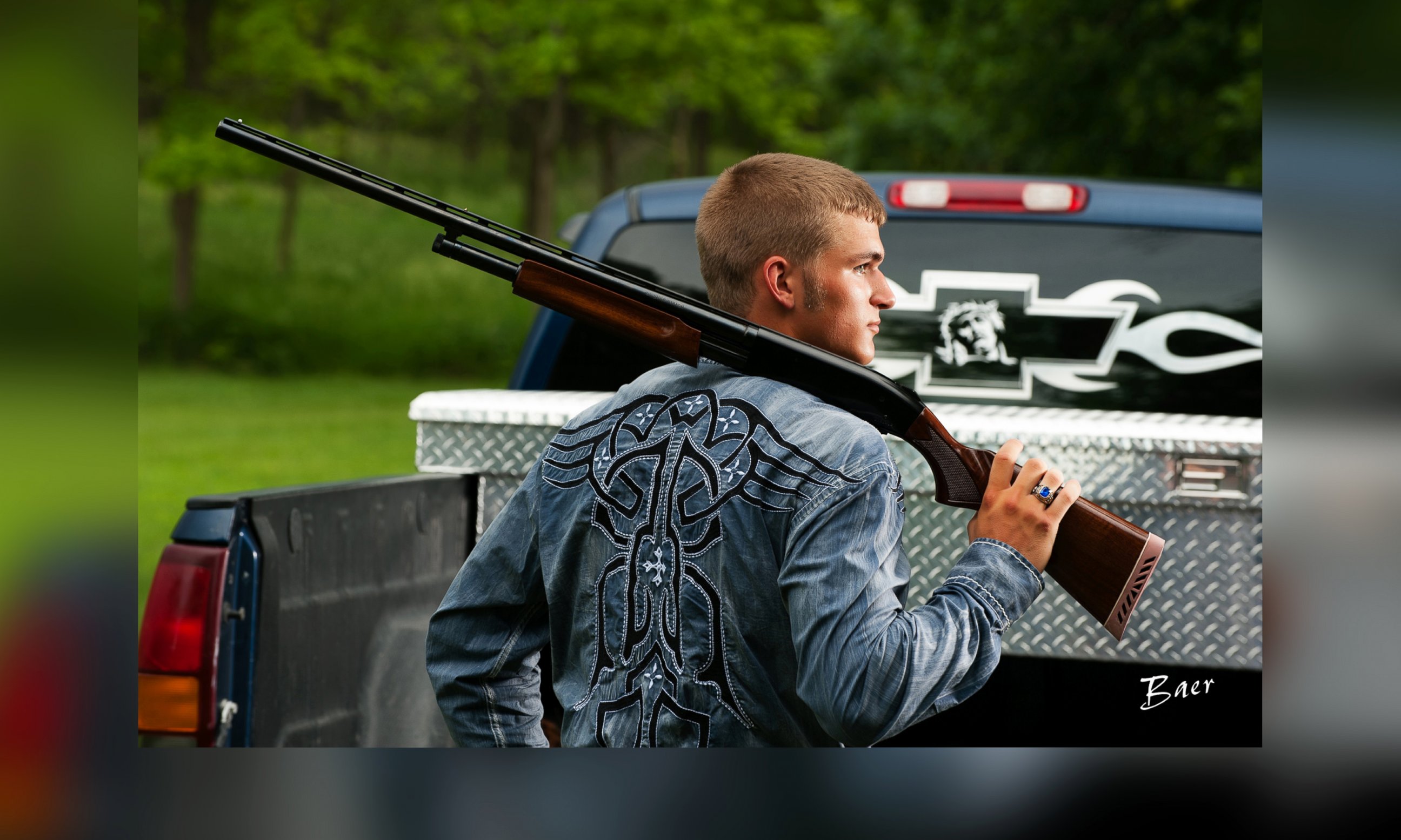 PHOTO: Dustin Langenberg of Bertrand, Neb. poses with a gun and a Ford truck.