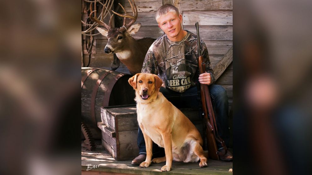 PHOTO: Nebraska senior Christian Burr poses with his dog, trophy mount and a rifle given to him by his grandfather.