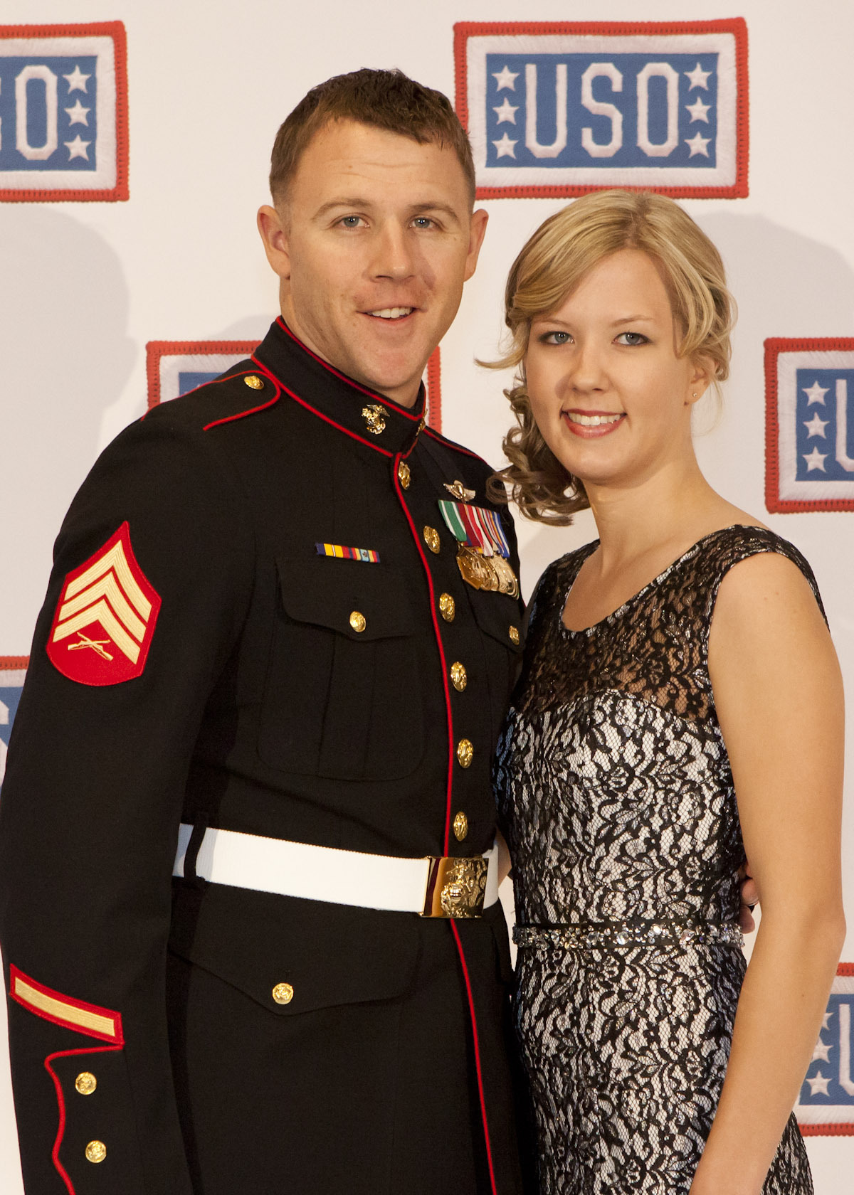 PHOTO: U.S. Marine Corps Sgt. Andrew C. Seif, left, poses for a photo with his wife, Dawn, during the reception before the 2013 USO Gala in Washington, Oct. 25, 2013. 