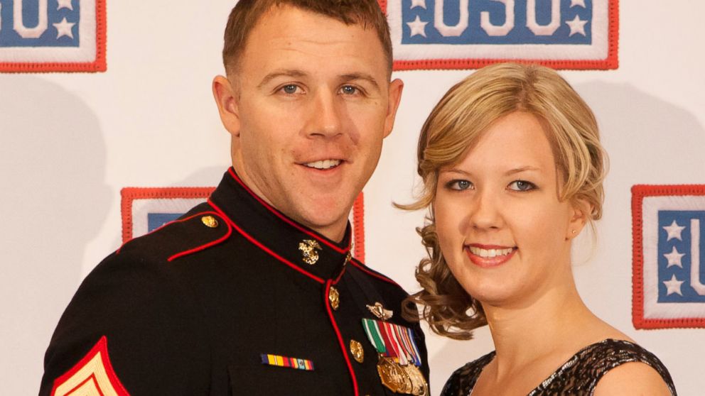 PHOTO: U.S. Marine Corps Sgt. Andrew C. Seif, left, poses for a photo with his wife, Dawn, during the reception before the 2013 USO Gala in Washington, Oct. 25, 2013. 