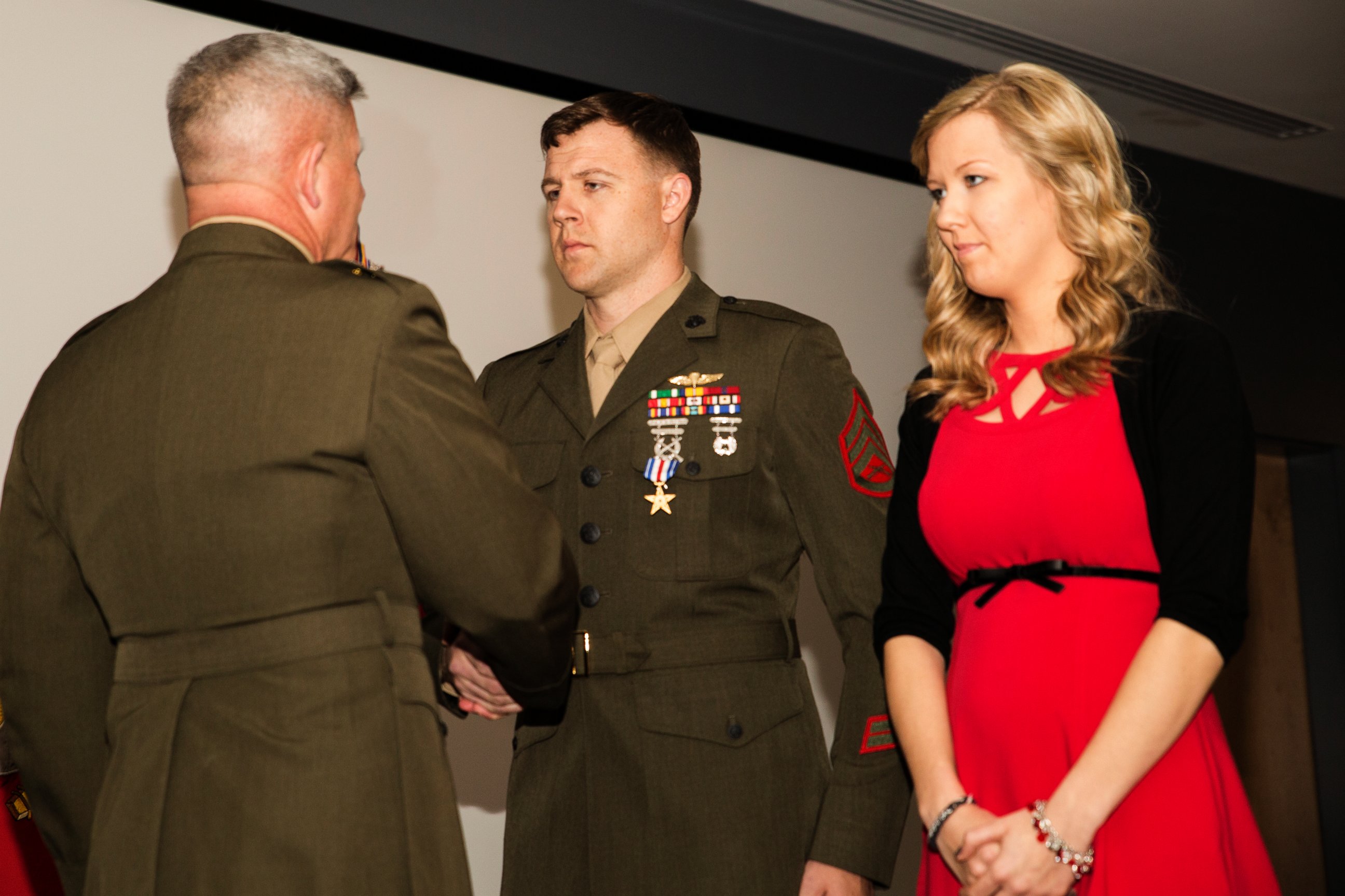 PHOTO: Major Gen. Joseph L. Osterman, commander, U.S. Marine Corps Forces, Special Operations Command, awards Staff Sgt. Andrew C. Seif the Silver Star Medal during a ceremony at Stone Bay aboard Marine Corps Base Camp Lejeune, N.C., March 6, 2015.