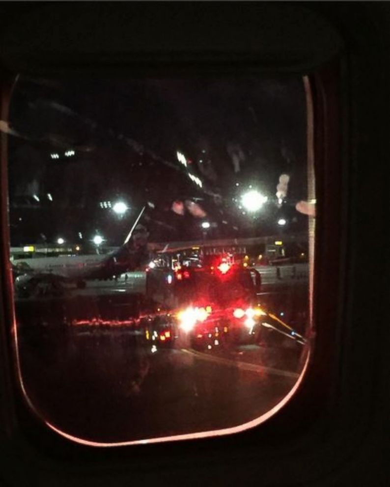 PHOTO: Aaron Sandler, a passenger onboard a Southwest Airlines flight that returned to Salt Lake City International Airport shortly after takeoff due to an engine issue on June 28, 2016, took this photo of awaiting fire crews.