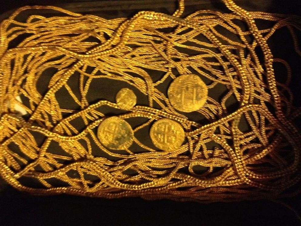 PHOTO: Gold chains and coins Eric Schmitt discovered at the same shipwreck last year.