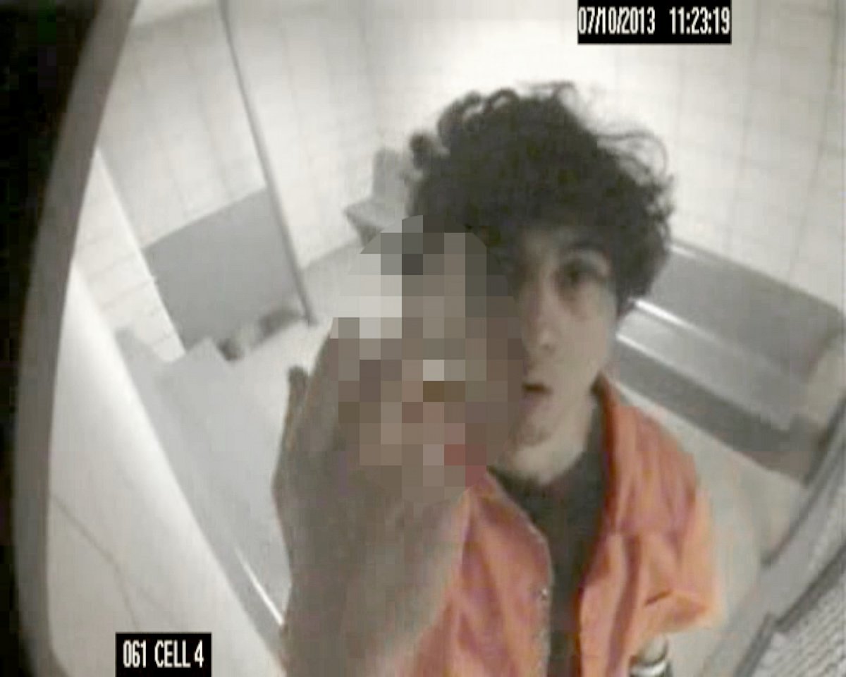 PHOTO:  In an image released in court, Boston Marathon bomber Dzhokhar Tsarnaev makes an obscene gesture at the camera while in a cell in July 2013.