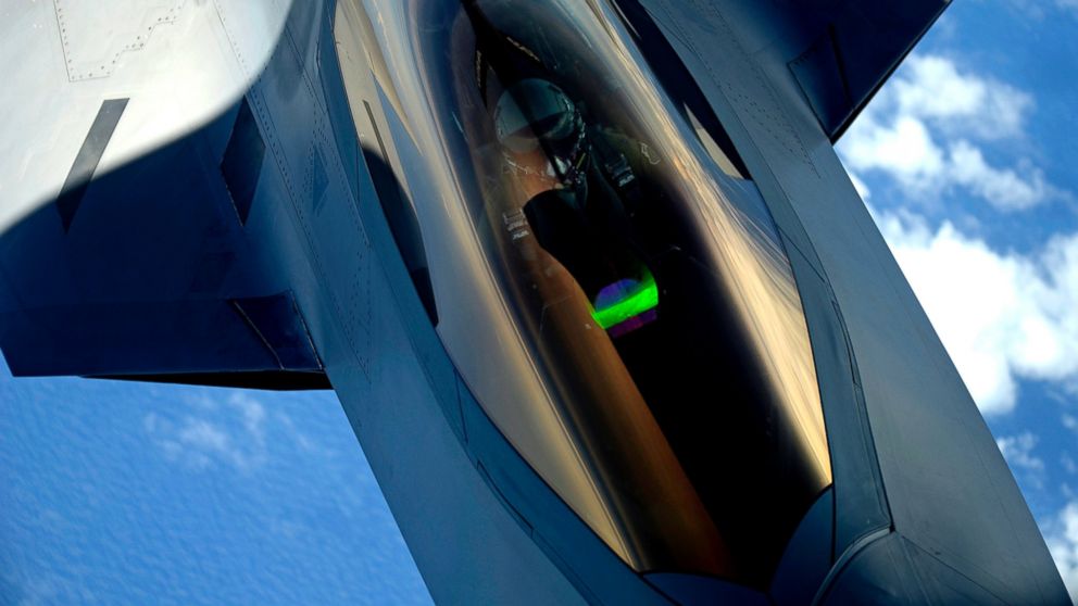 PHOTO: A U.S. Air Force F-22 Raptor aircraft with the 1st Fighter Wing receives a midair refueling from a KC-135 Stratotanker aircraft assigned to the 756th Air Refueling Wing over Joint Base Andrews in Maryland July 10, 2012.