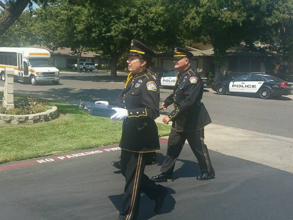 PHOTO: Los Angeles Airport Police officers hand-delivered a lost wedding photo album to a family, July 30, 2015, in Modesto, California.