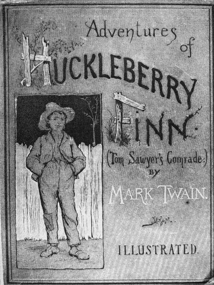 PHOTO: FILE - Cover of the book 'Adventures of Huckleberry Finn (Tom Sawyer's Comrade)' by Mark Twain (Samuel Clemens), 1884. The illustration, by E. M. Kimble, shows a young boy who stands in front of a picket fence while wearing a straw hat.