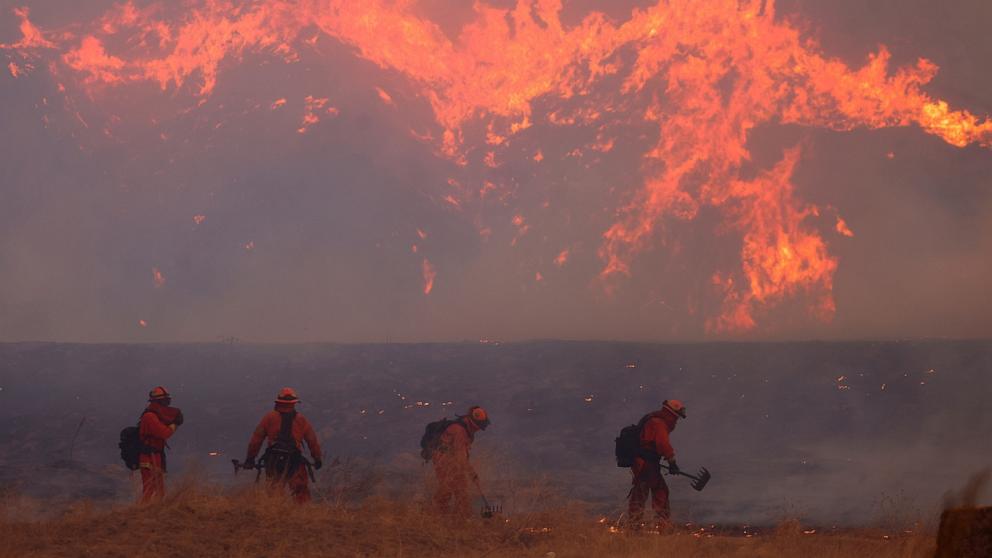 PHOTO: Firefighters work as the Hughes Fire burns in Castaic Lake, Calif., on Jan. 22, 2025.