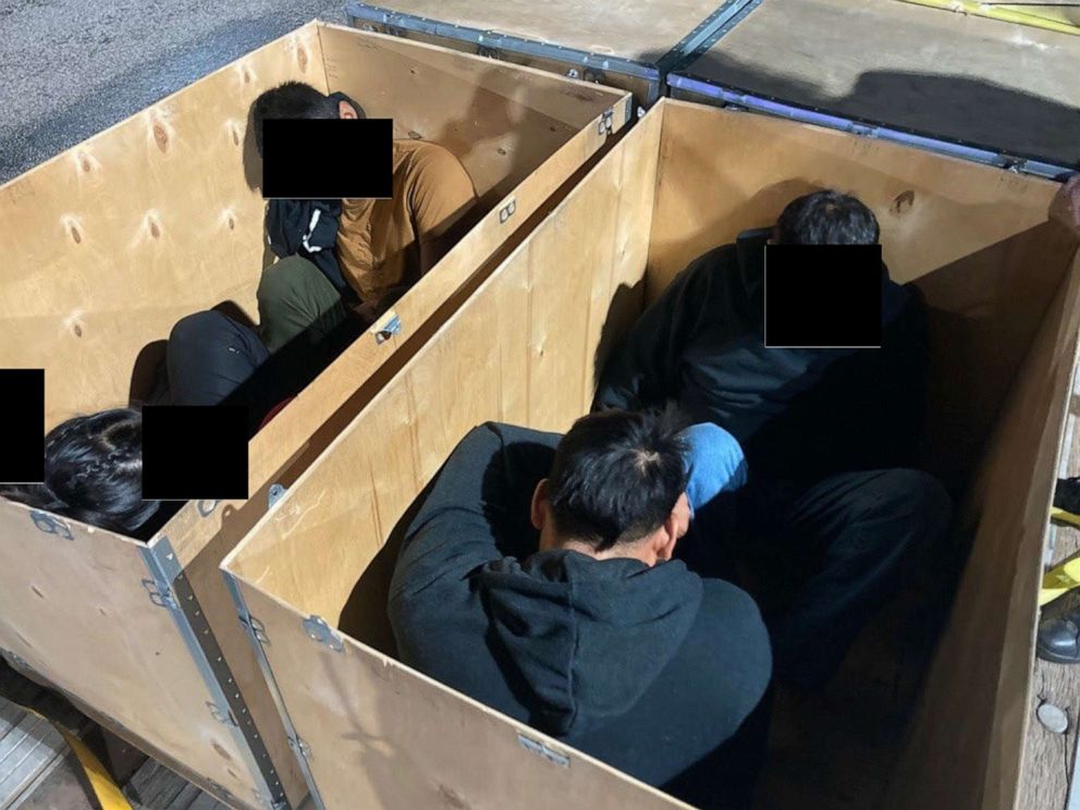 PHOTO: Migrants inside a wooden crate are seen in an handout from DOJ.
