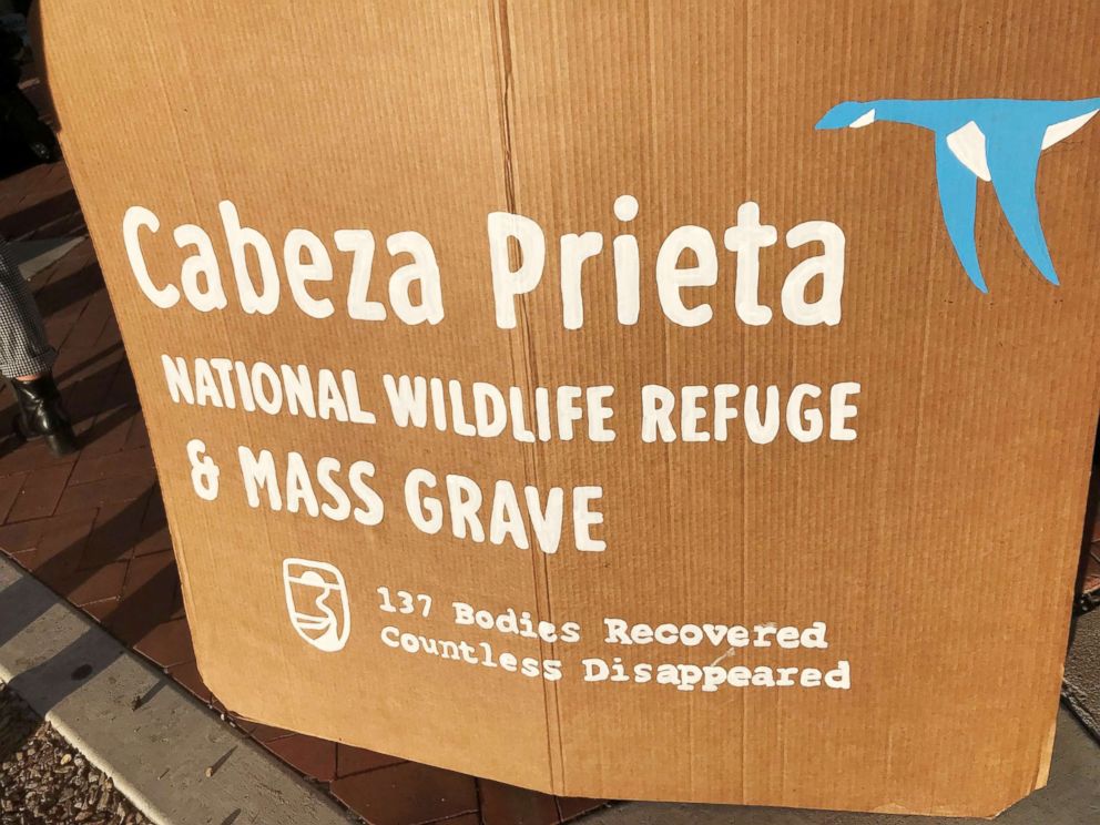 PHOTO: Supports of four humanitarian aid volunteers facing criminal charges for dropping off water at the Cabeza Prieta National Wildlife Refuge display this sign, showing the number of recovered human remains found in the remote desert wilderness.