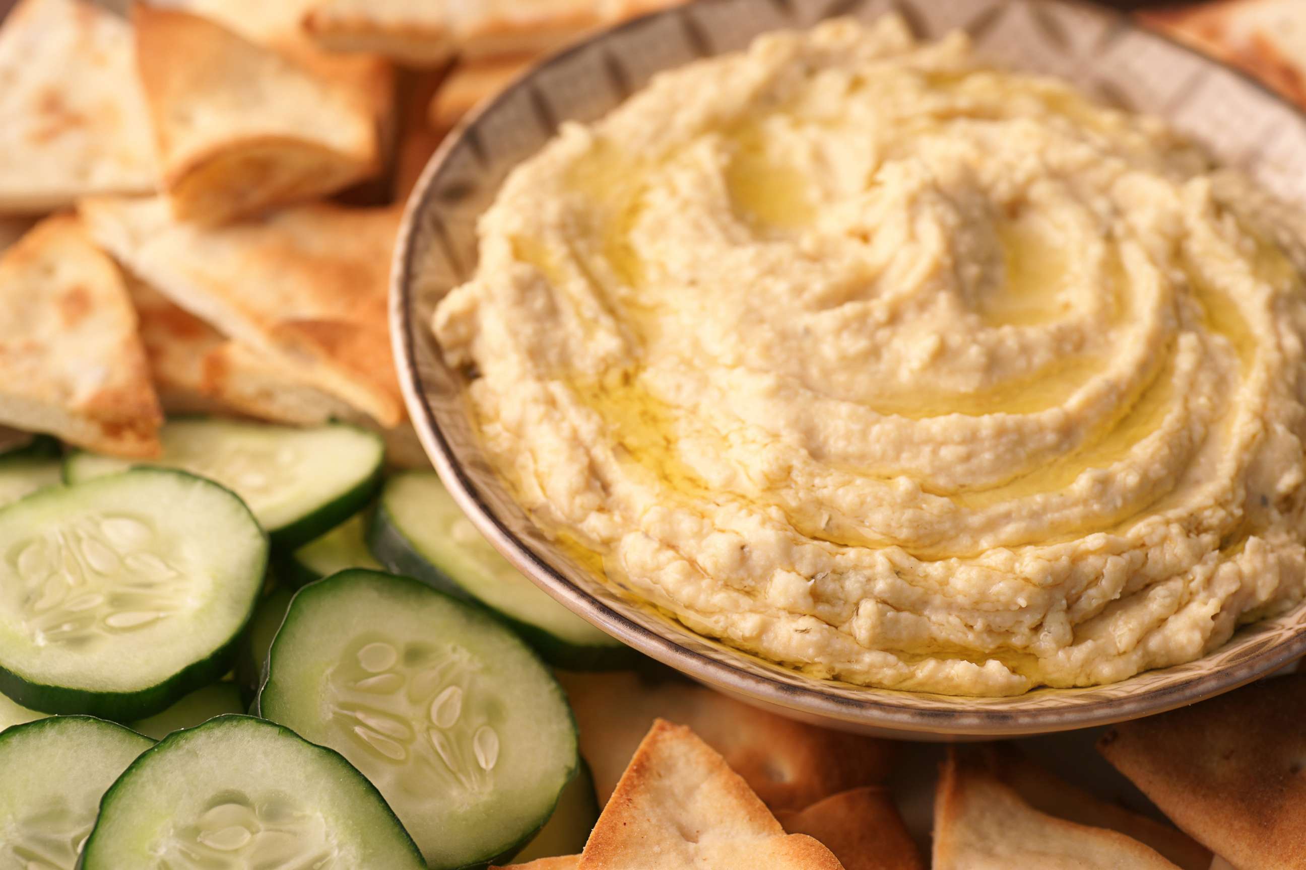 PHOTO: This file photo shows a bowl of hummus served with cucumbers and pita.