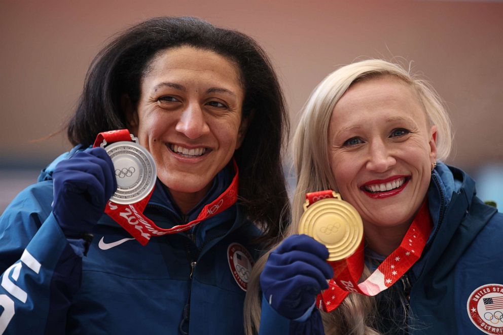 PHOTO: Silver medalist Elana Meyers Taylor and gold medalist Kaillie Humphries of the United States celebrate during the women's monobob medal ceremony at the 2022 Olympic Games at National Sliding Centre on Feb. 14, 2022, in Yanqing, China.
