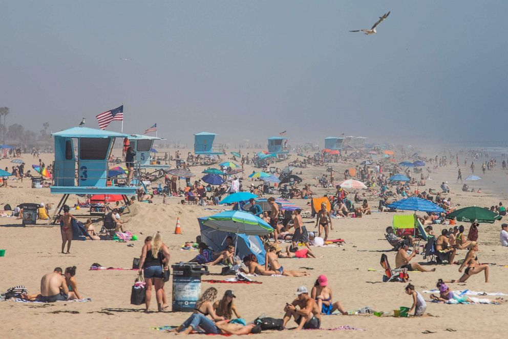 PHOTO: In this file photo taken on April 25, 2020, people enjoy the beach amid the coronavirus pandemic in Huntington Beach, California.