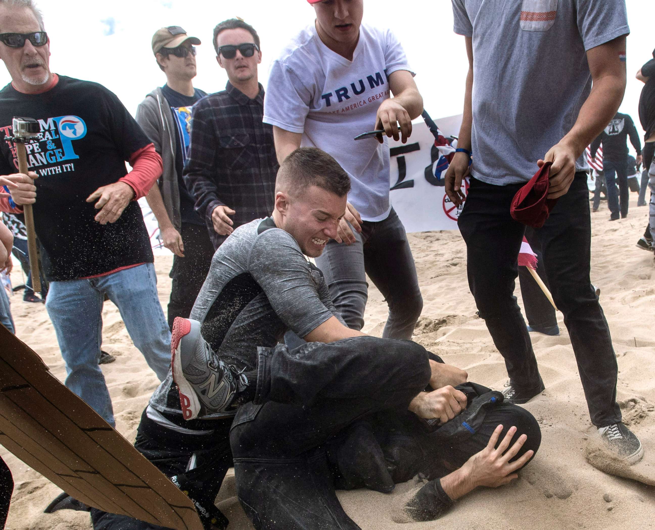 PHOTO: White nationalist Robert Rundo, center, clashes with an anti-Trump protester, bottom center, in Huntington Beach, Calif., March 25, 2017.