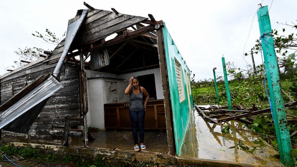 PHOTO: Caridad Alvarez stands in her house destroyed by Hurricane Ian, in San Juan y Martinez, Pinar del Rio Province, Cuba, Sept. 27, 2022.