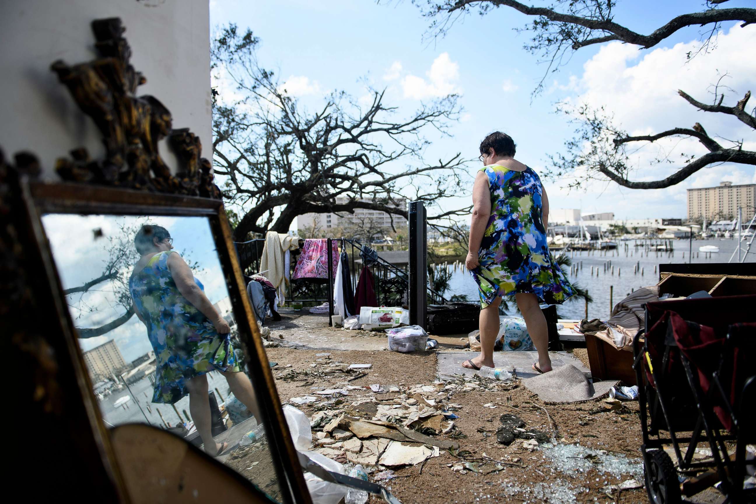 PHOTO: Teresa Sheffield walks out of the remains of her second floor apartment in the aftermath of Hurricane Michael Oct. 11, 2018 in Panama City, Fla.