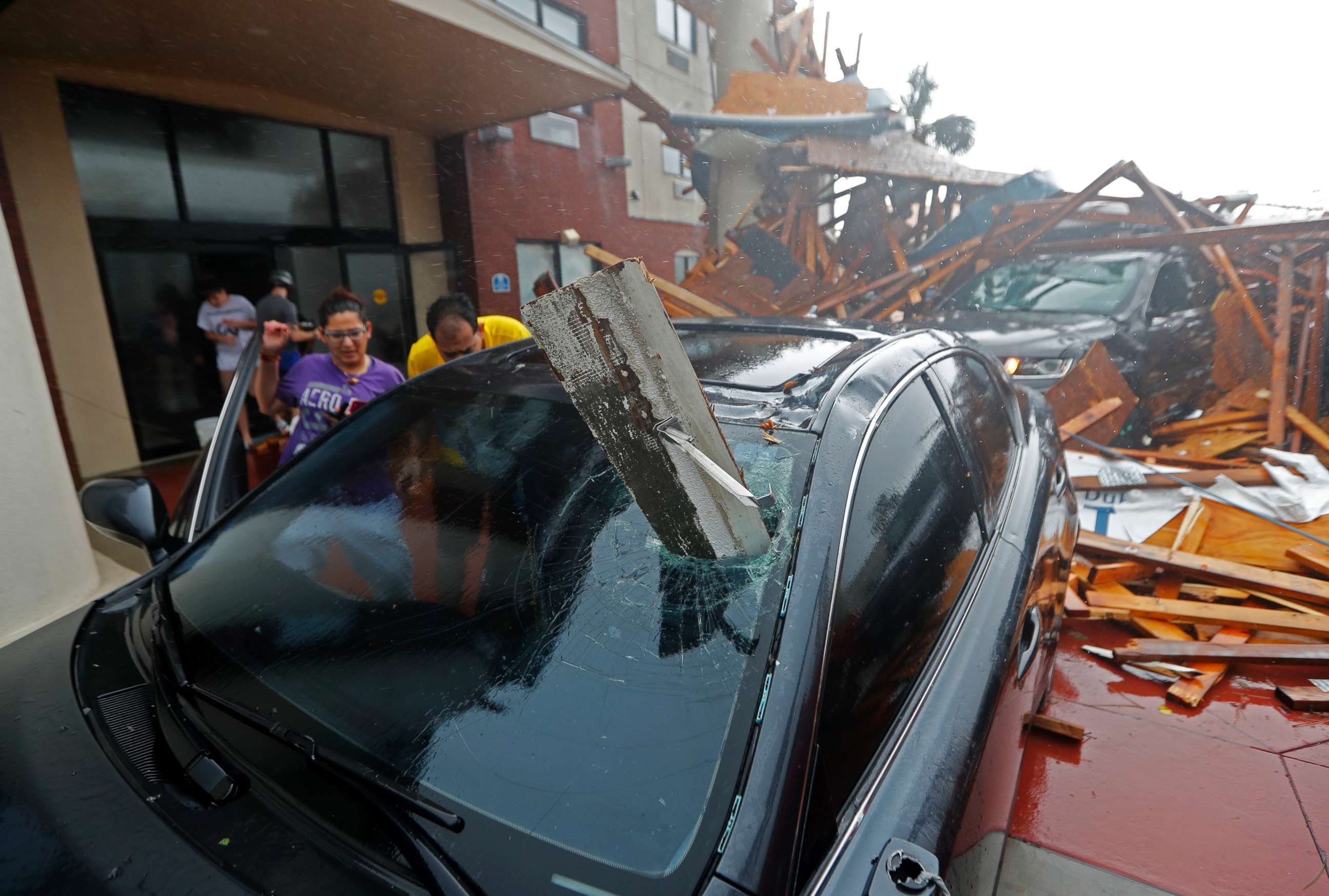PHOTO: A woman checks on her vehicle as Hurricane Michael passes through in Panama City Beach, Fla., Oct. 10, 2018. 