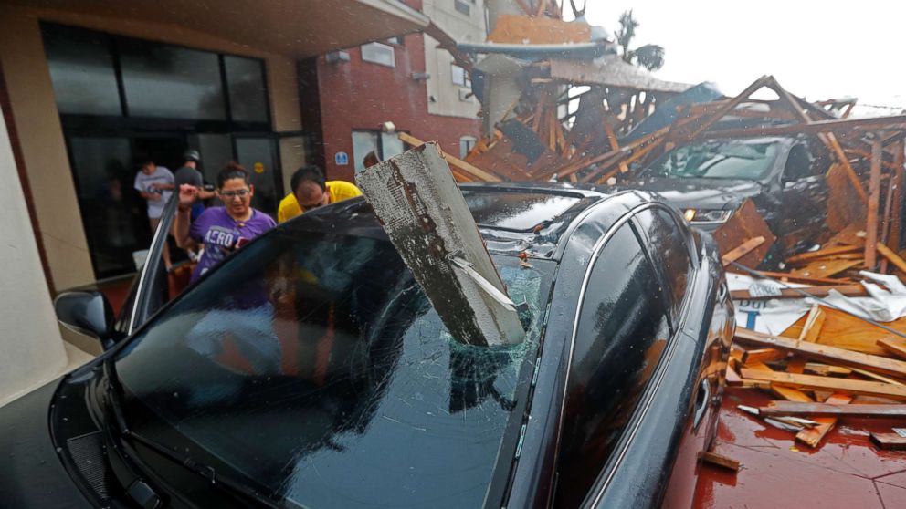 PHOTO: A woman checks on her vehicle as Hurricane Michael passes through in Panama City Beach, Fla., Oct. 10, 2018. 