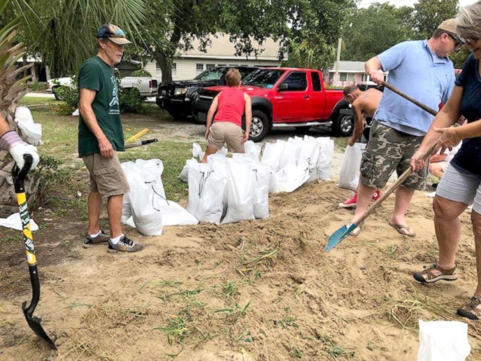 PHOTO: People fill sandbags to prepare for Hurricane Dorian in Savannah, Georgia on September 2, 2019.