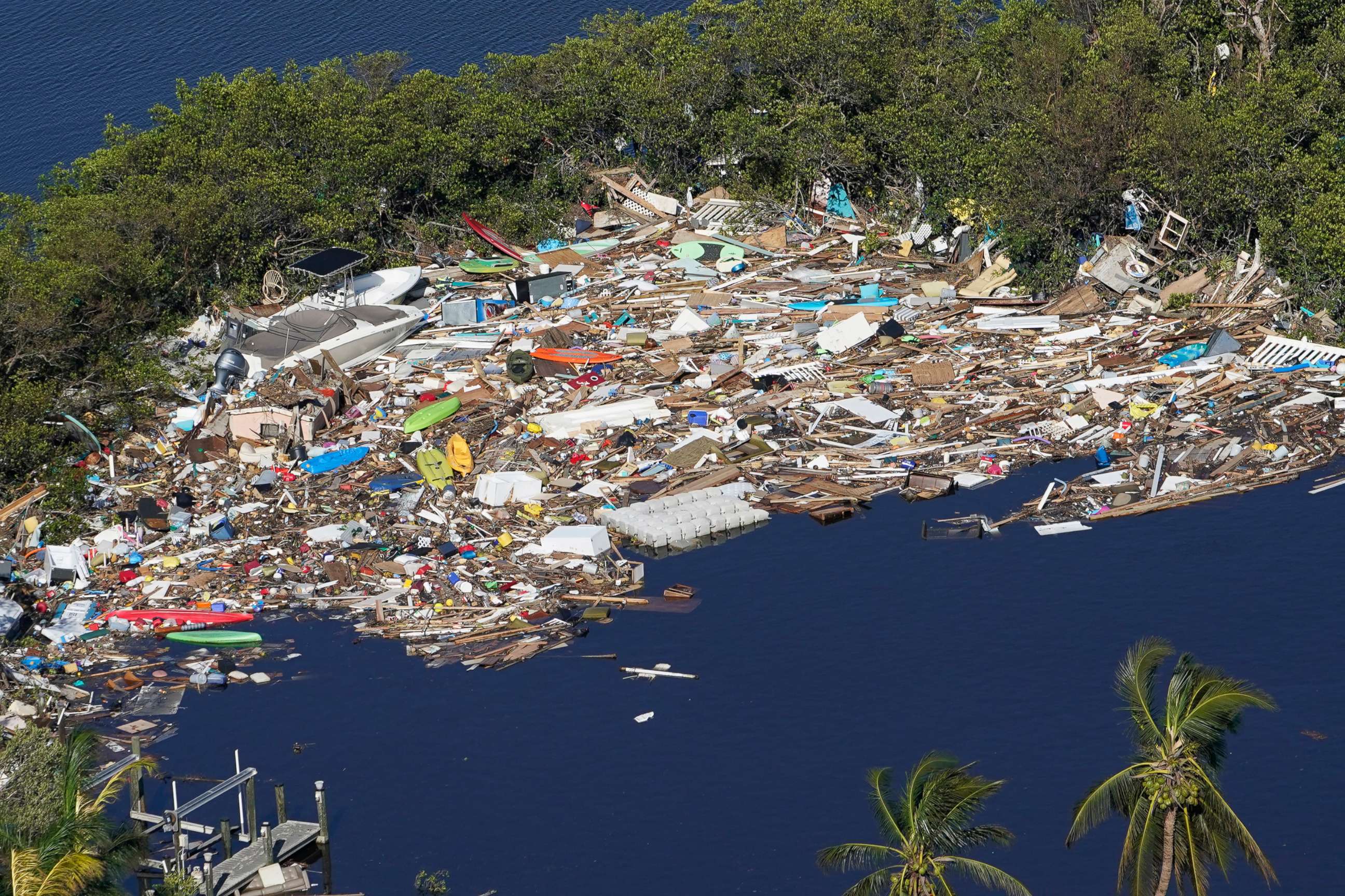 PHOTO: Debris is piled up at the end of a cove following heavy winds and storm surge caused by Hurricane Ian, Sept. 29, 2022, in Barefoot Beach, Fla. 