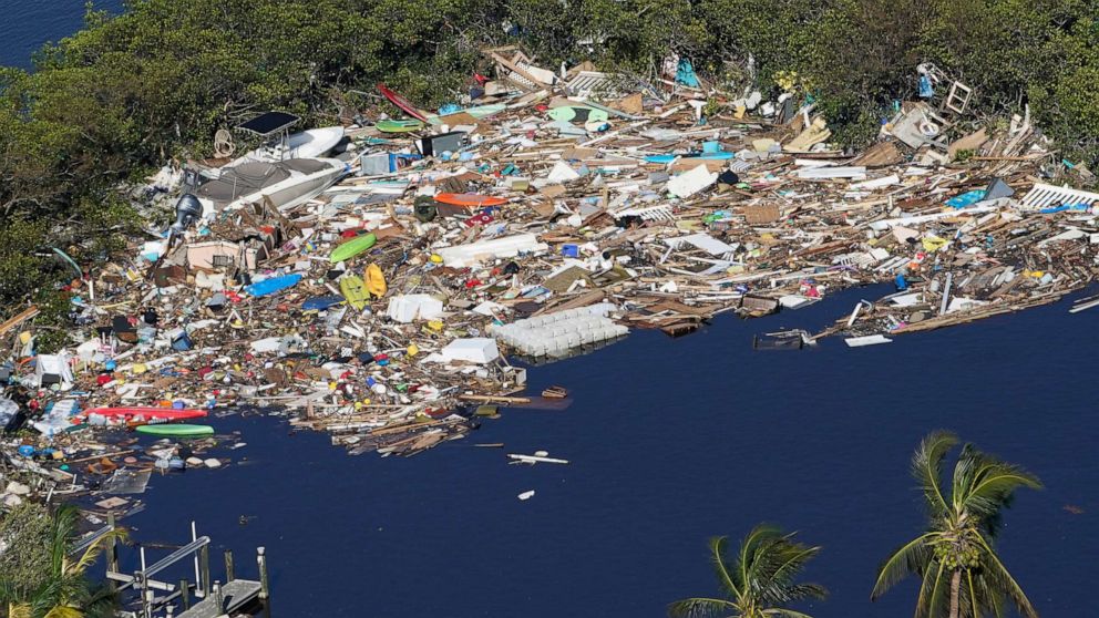 PHOTO: Debris is piled up at the end of a cove following heavy winds and storm surge caused by Hurricane Ian, Sept. 29, 2022, in Barefoot Beach, Fla. 
