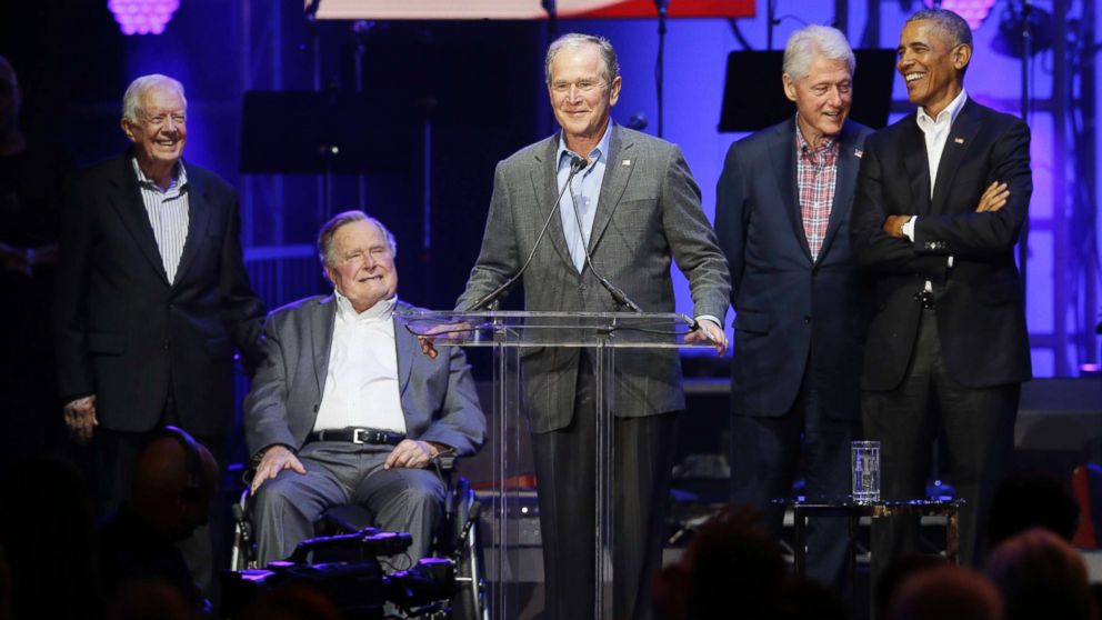 PHOTO: Former President George W. Bush, center, speaks as fellow former Presidents from right, Barack Obama, Bill Clinton, George H.W. Bush and Jimmy Carter look on during a hurricanes relief concert in College Station, Texas, Oct. 21, 2017.