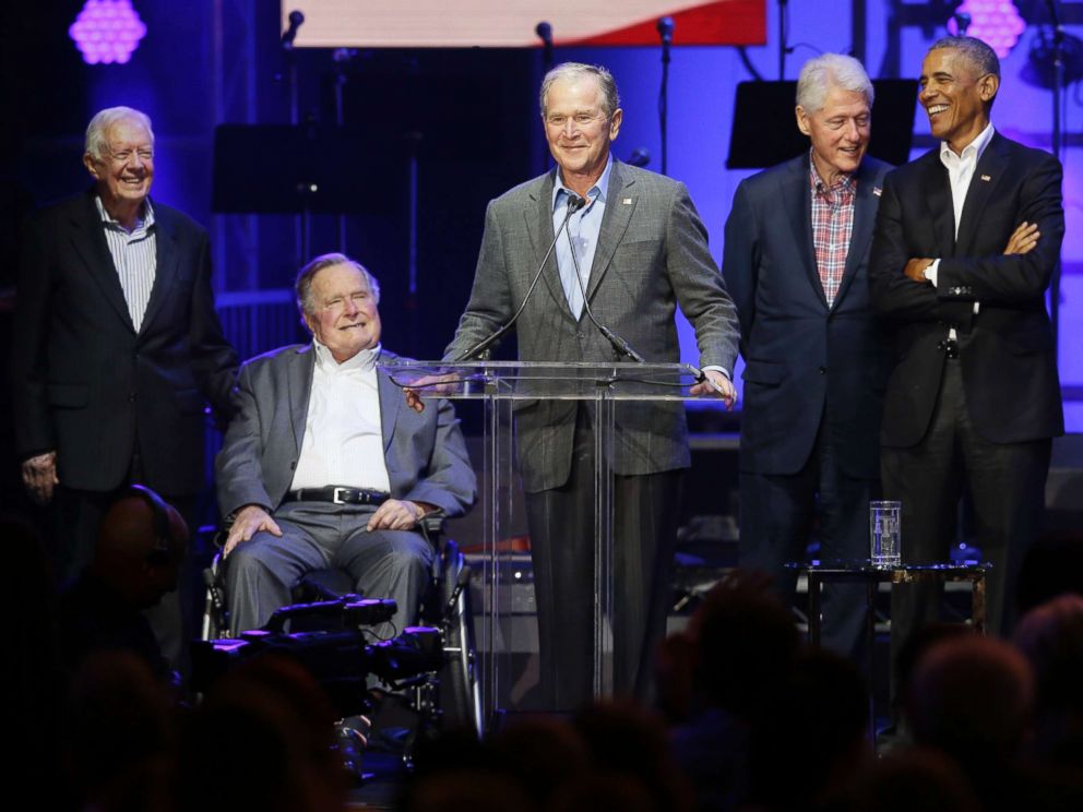 PHOTO: Former President George W. Bush, center, speaks as fellow former Presidents from right, Barack Obama, Bill Clinton, George H.W. Bush and Jimmy Carter look on during a hurricanes relief concert in College Station, Texas, Oct. 21, 2017.