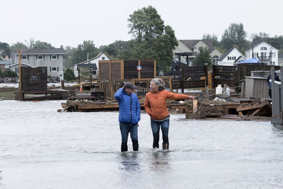 PHOTO: Residents stand in flood waters following the passing of Hurricane Fiona, later downgraded to a post-tropical cyclone, in Shediac, New Brunswick, Canada, on Sept. 24, 2022.