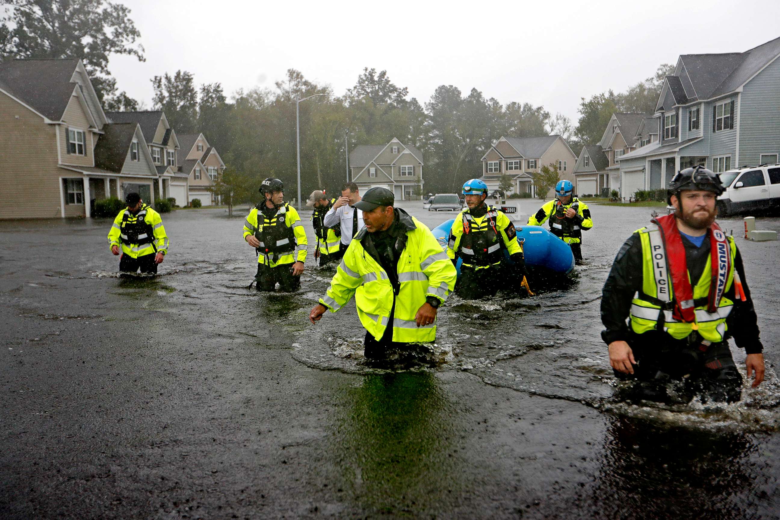PHOTO: Members of the North Carolina Task Force urban search and rescue team wade through a flooded neighborhood looking for residents who stayed behind as Hurricane Florence continues to dump heavy rain in Fayetteville, N.C., Sept. 16, 2018.