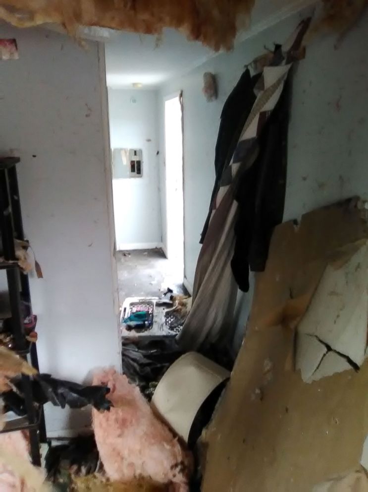 PHOTO: The ceiling in their living room "collapsed" and the insulation is exposed.
