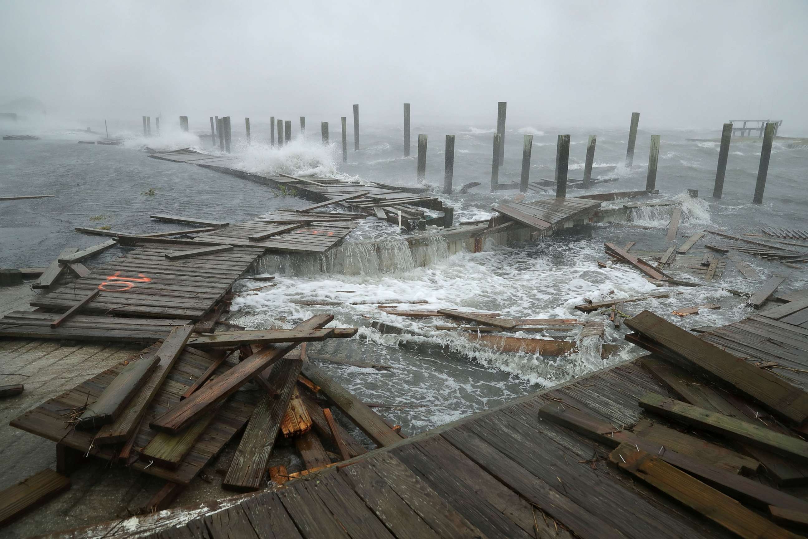 PHOTO: Portions of a boat dock and boardwalk are destroyed by powerful wind and waves as Hurricane Florence arrives in Atlantic Beach, N.C., Sept. 13, 2018. 