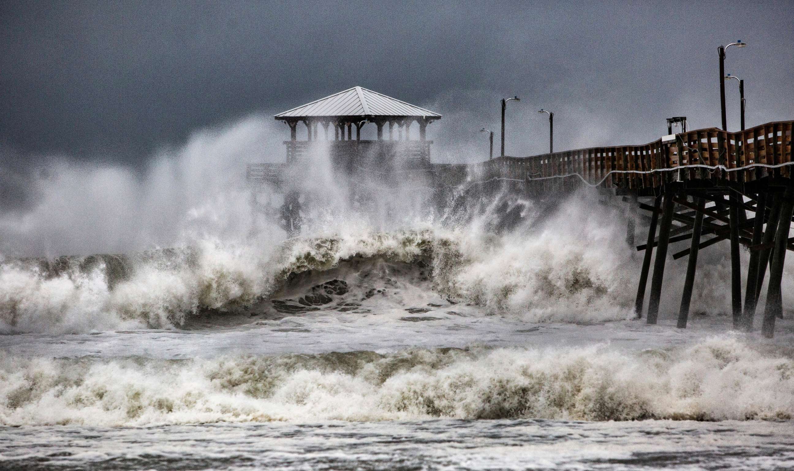 PHOTO: Waves slam the Oceana Pier & Pier House Restaurant in Atlantic Beach, N.C.,  Sept. 13, 2018 as Hurricane Florence approaches the area.