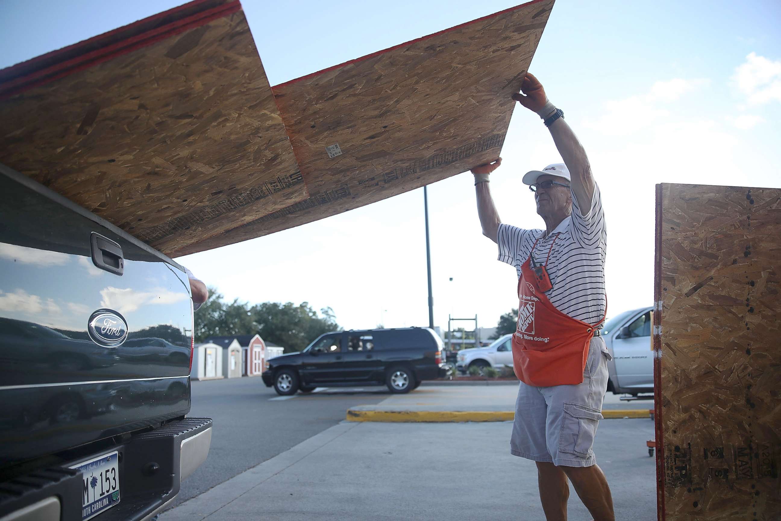 PHOTO: Home Depot employee Richard Balderson helps a customer load plywood into his truck as residents prepare for the arrival of Hurricane Florence, Sept. 11, 2018, in Myrtle Beach, S.C.