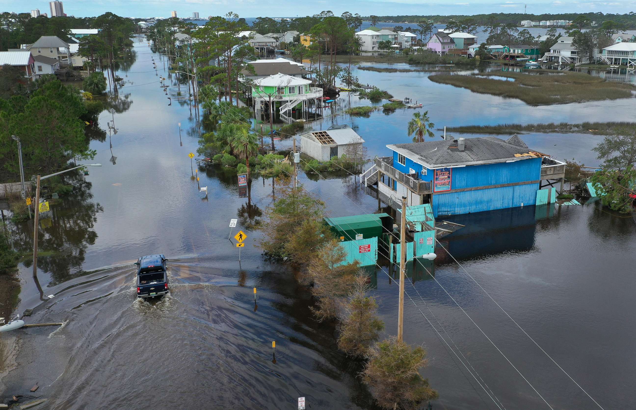PHOTO: An aerial view shows a vehicle driving through a flooded street after Hurricane Sally passed through the area, Sept. 17, 2020, in Gulf Shores, Ala. 