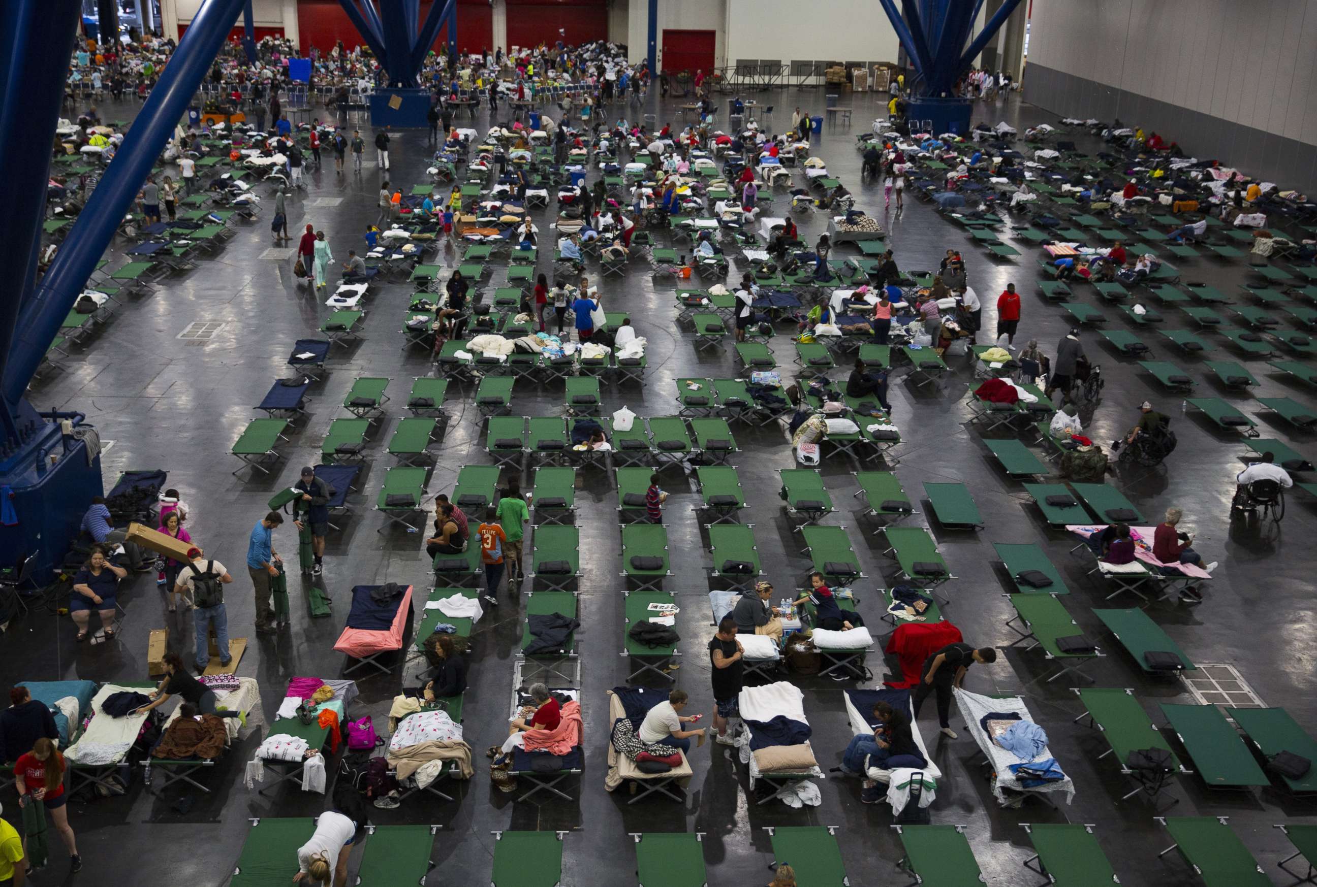 PHOTO: Evacuees fill up cots at the George Brown Convention Center that has been turned into a shelter run by the American Red Cross to house victims of Hurricane Harvey, Aug. 28, 2017, in Houston.
