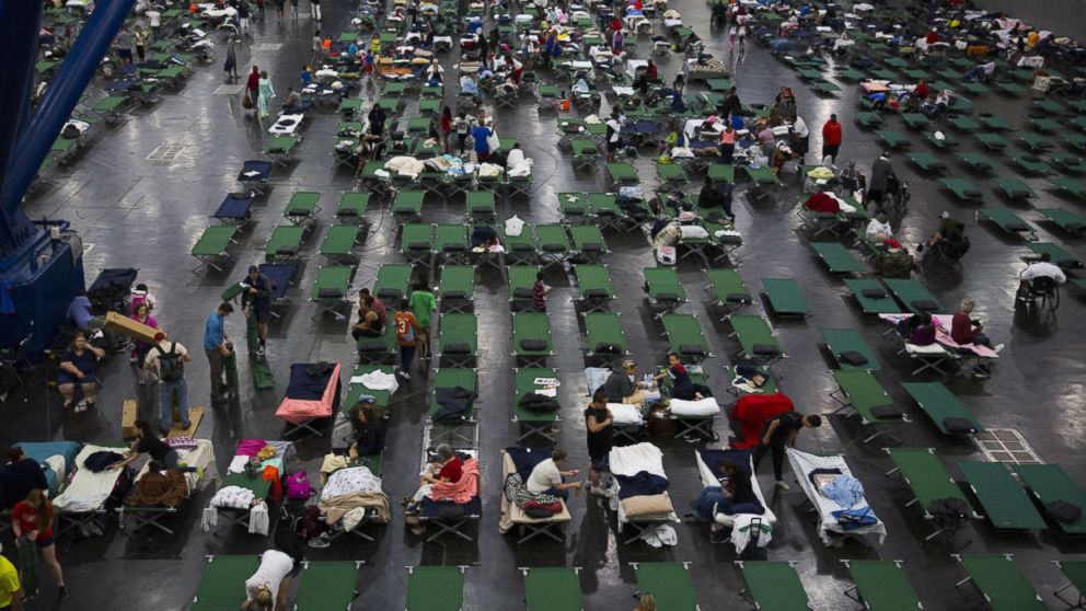 PHOTO: Evacuees fill up cots at the George Brown Convention Center that has been turned into a shelter run by the American Red Cross to house victims of Hurricane Harvey, Aug. 28, 2017, in Houston.