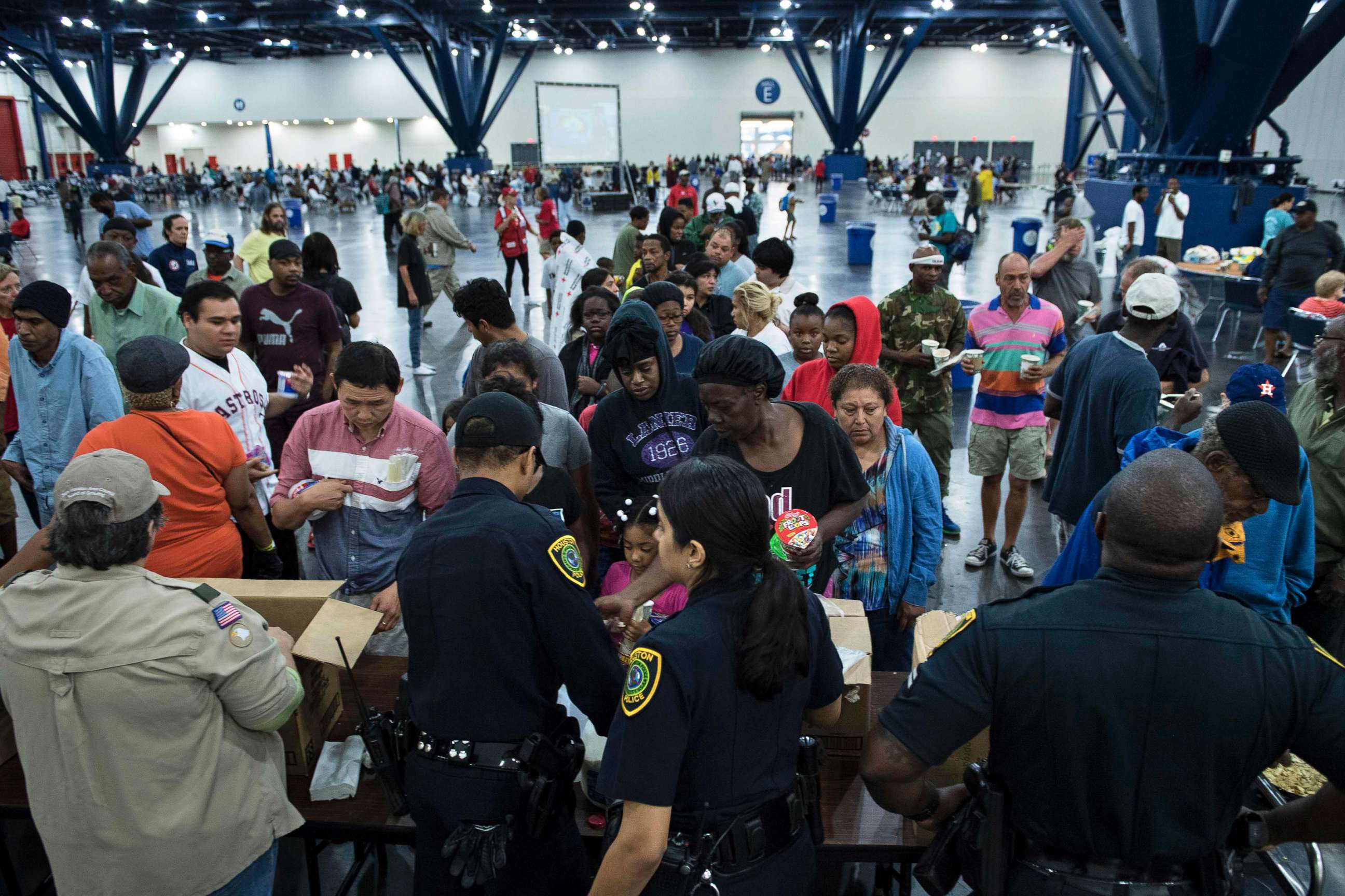 PHOTO: Flood victims gather for food at a shelter in the George R. Brown Convention Center during the aftermath of Hurricane Harvey, August 28, 2017, in Houston, Texas.