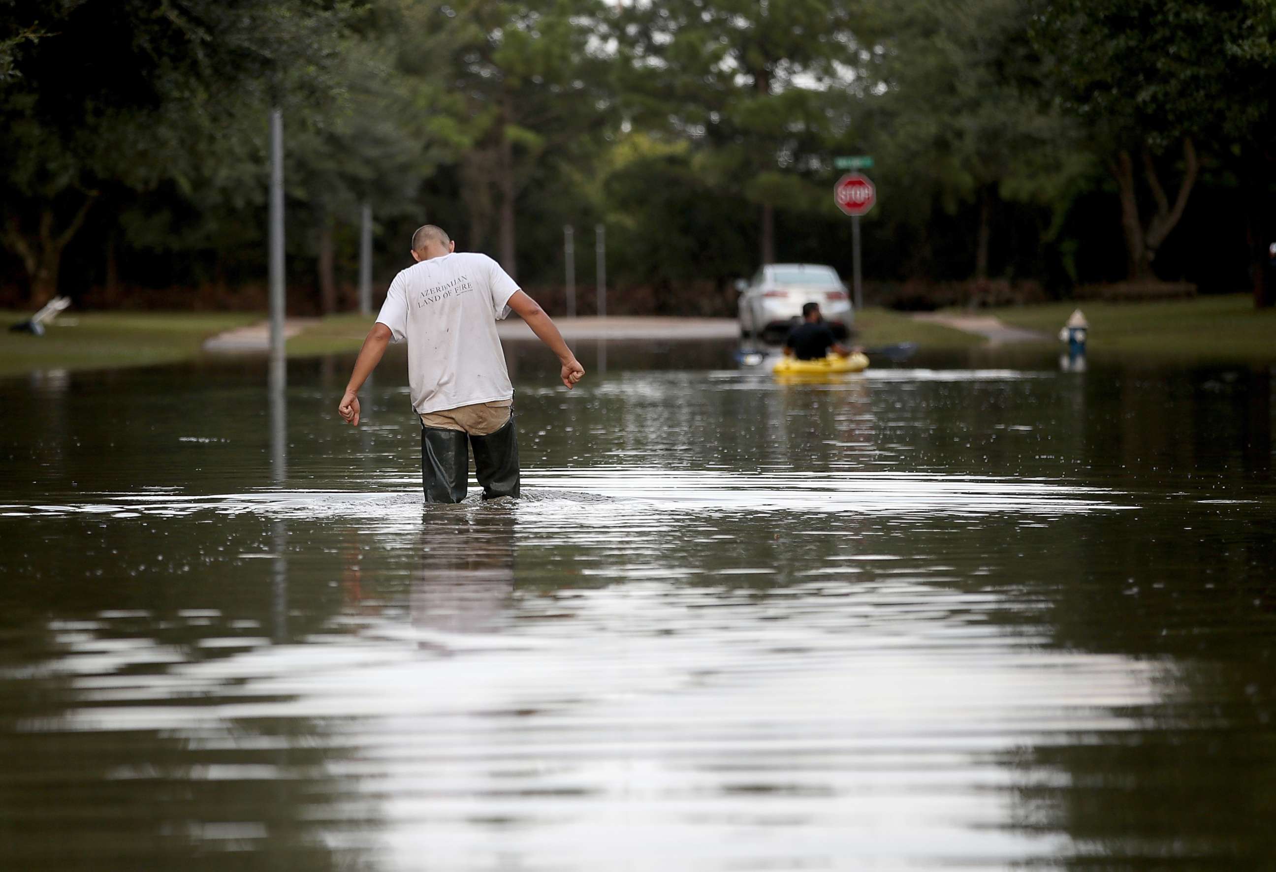 PHOTO: A man walks through a flooded street, Sept. 4, 2017, in Katy, Texas. Over a week after Hurricane Harvey hit Southern Texas.