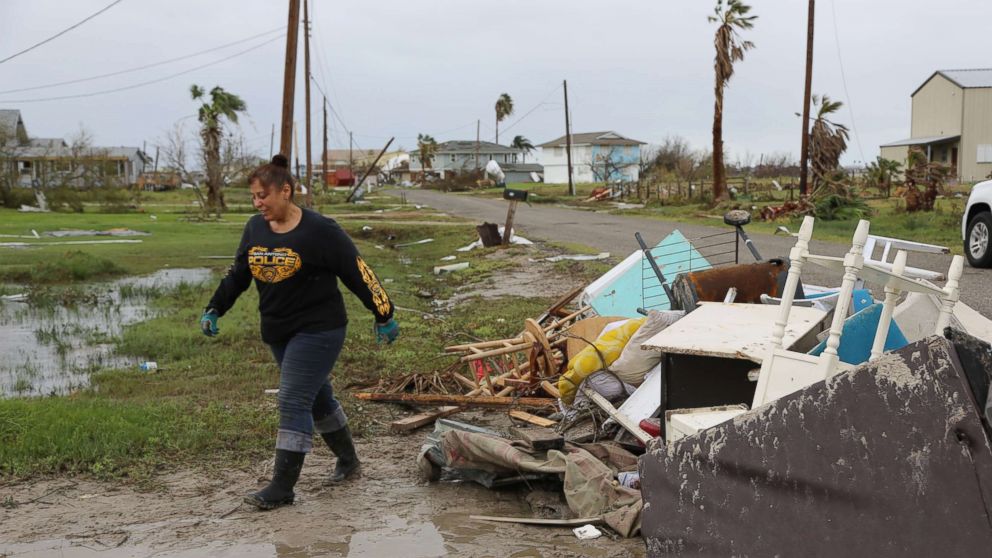 PHOTO: Christina and Robert Urdiales clean up debris around their destroyed second home in Rockport, Texas on Monday, August 28. They had planned to retire there before Hurricane Harvey hit.