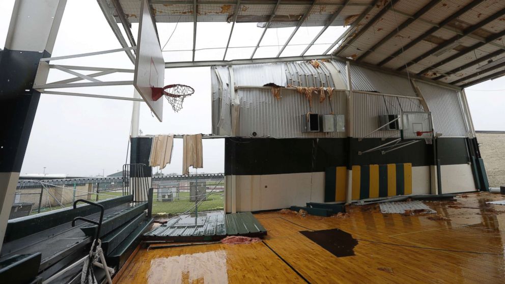 PHOTO: The basketball facility for Rockport High School is exposed to the outside after it lost part of its roof and walls from Hurricane Harvey, Aug. 26, 2017, in Rockport, Texas. 