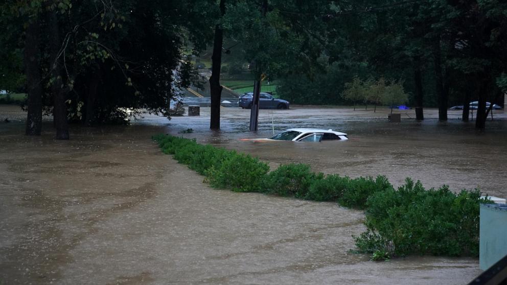 PHOTO: A car is submerged in the floodwaters in the Buckhead neighborhood in the aftermath of Hurricane Helene on Sept. 27, 2024 in Atlanta.