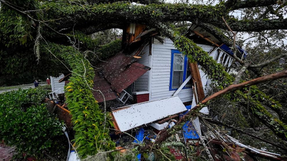 PHOTO: A damaged 100-year-old home is seen after an Oak tree landed on the home after Hurricane Helene moved through the area, Sept. 27, 2024, in Valdosta, Ga. 