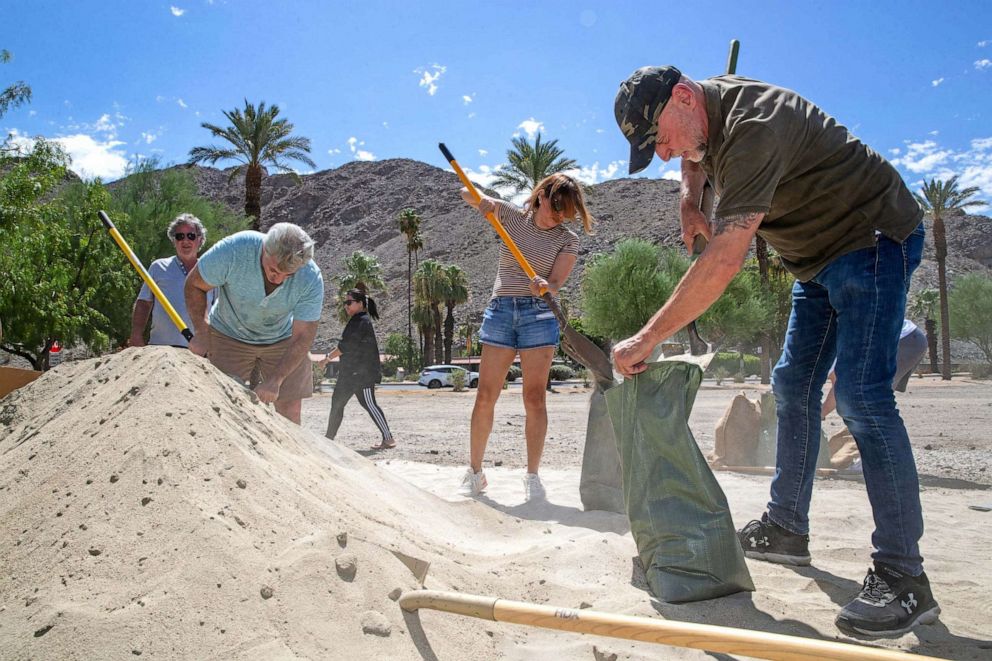 PHOTO: Ahead of widespread rain as Hurricane Hilary comes closer to the Coachella Valley, residents fill sandbags at the Rancho Mirage Library and Observatory in Rancho Mirage, Calif., on Aug. 18, 2023.