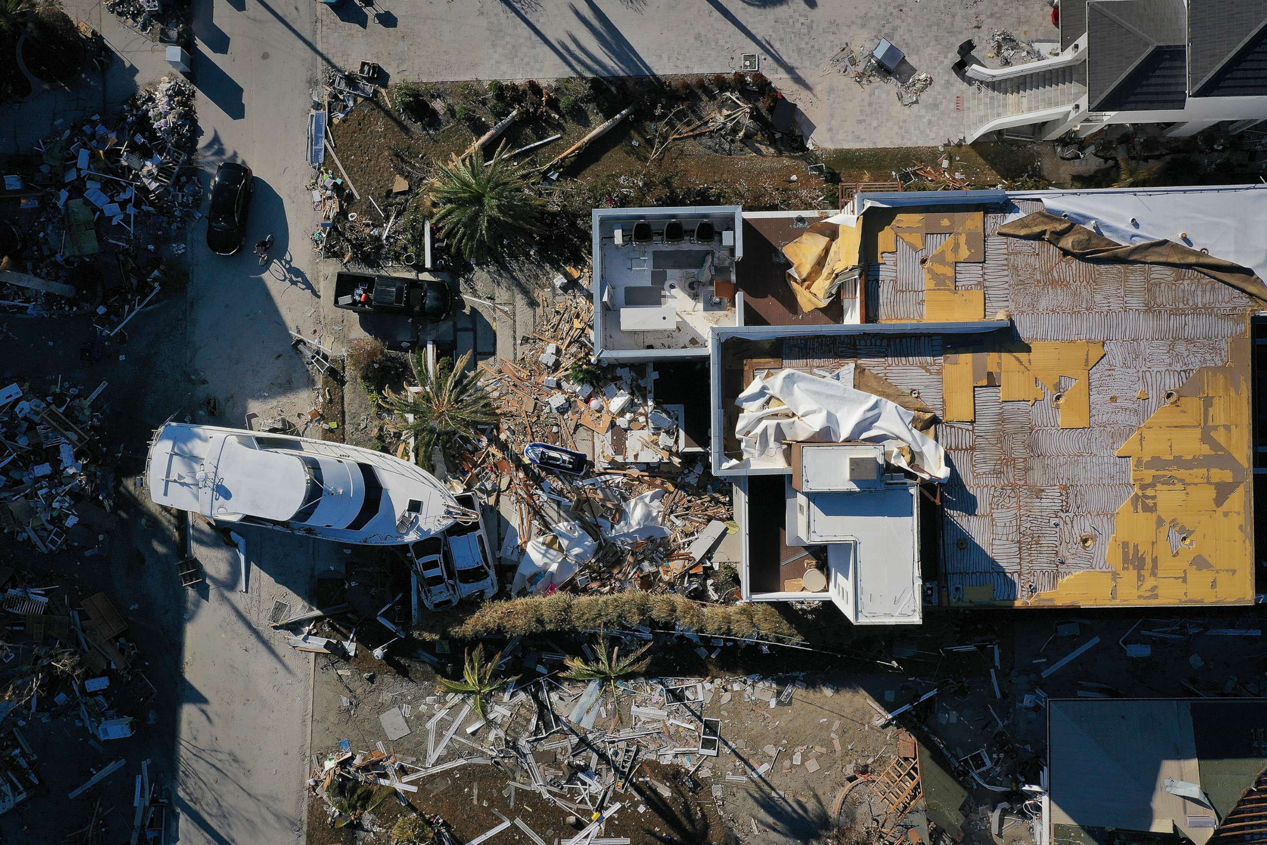 PHOTO: A yacht sits in the front yard of a home In the wake of Hurricane Ian, Oct. 2, 2022, in Fort Myers, Fla. 