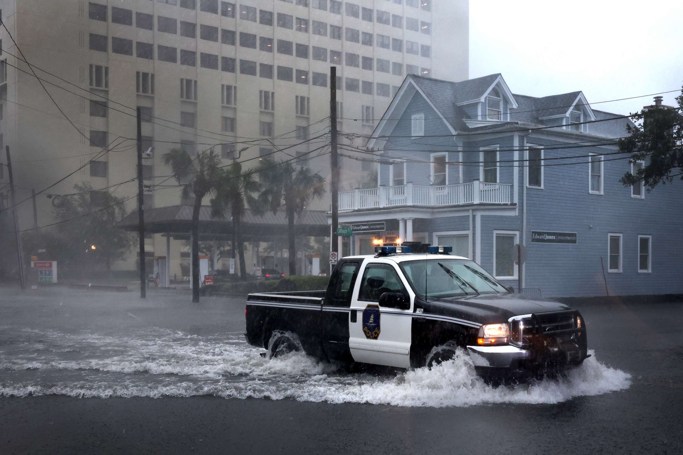 PHOTO: A police vehicle drives down a flooded street as rain from Hurricane Ian drenches the city, Sept. 30, 2022 in Charleston, South Carolina.