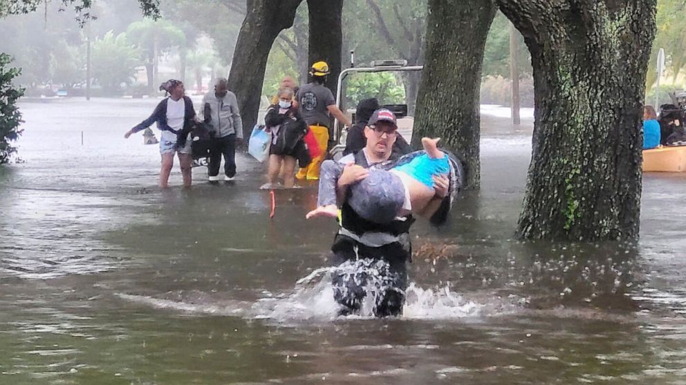 PHOTO: Orange County firefighters help people stranded by Hurricane Ian, Sept. 29, 2022 in Orange County, Fla.