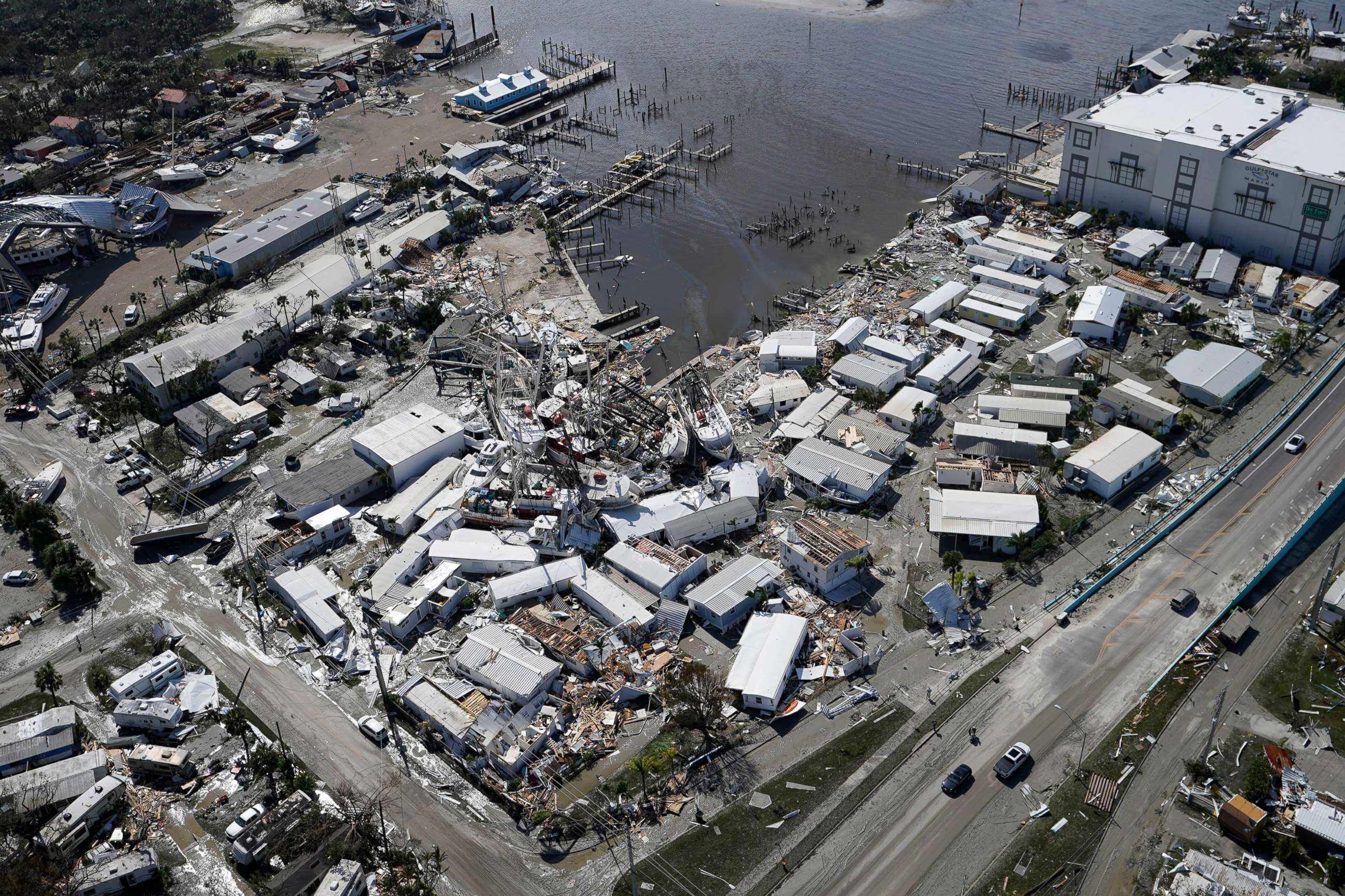 PHOTO: Damages boats lie on the land and water in the aftermath of Hurricane Ian, Sept. 29, 2022, in Fort Myers, Fla.