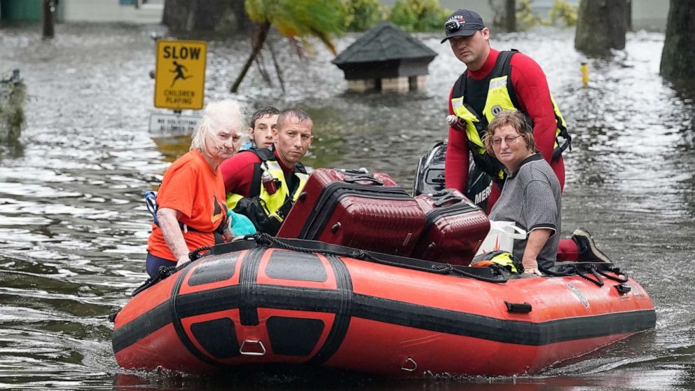 PHOTO: Residents are rescued from floodwaters in the aftermath of Hurricane Ian in Orlando, Fla., Sept. 29, 2022.