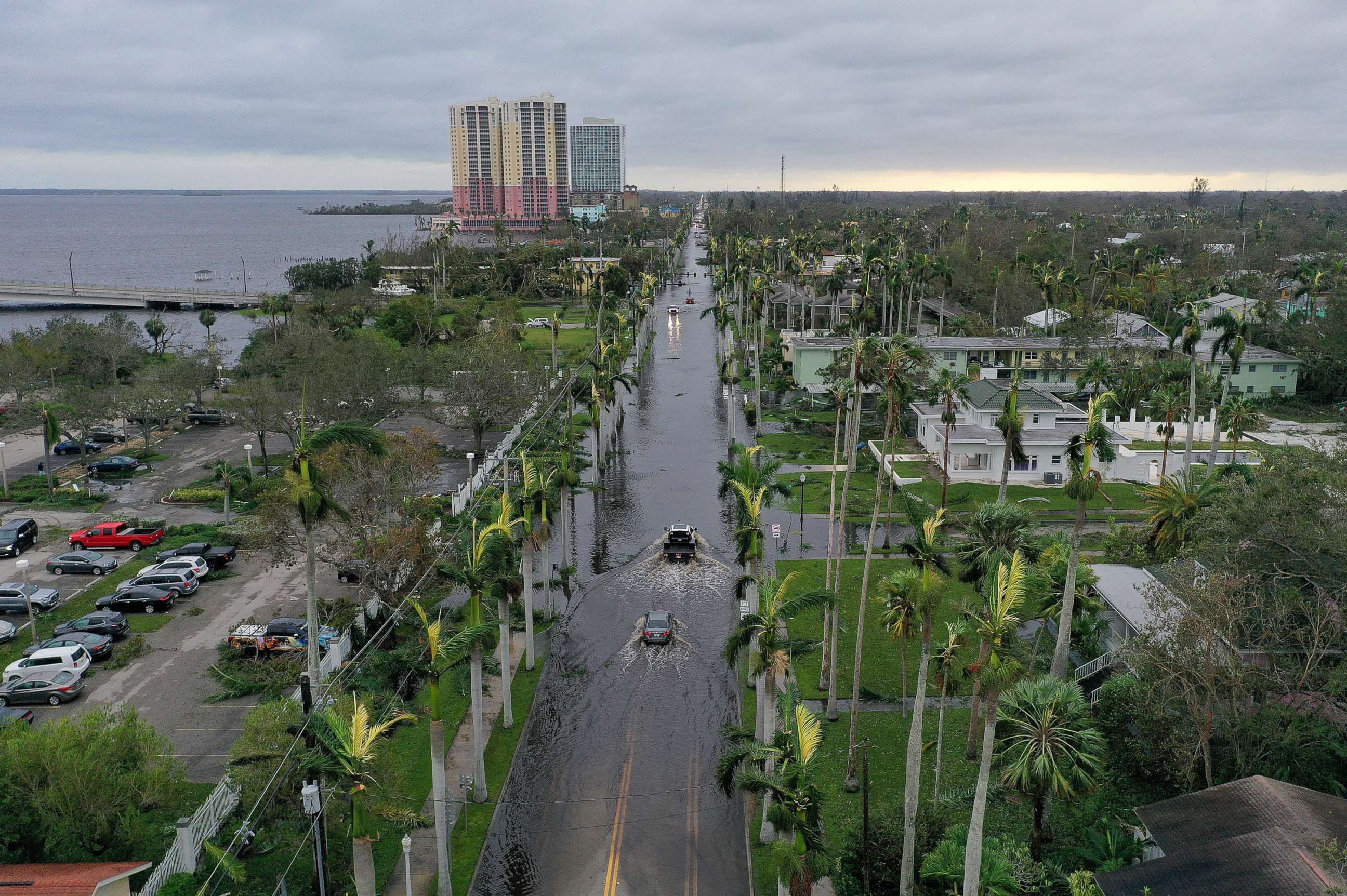PHOTO: Vehicles make their way through a flooded area after Hurricane Ian passed through the area on Sept. 29, 2022 in Fort Myers, Fla.